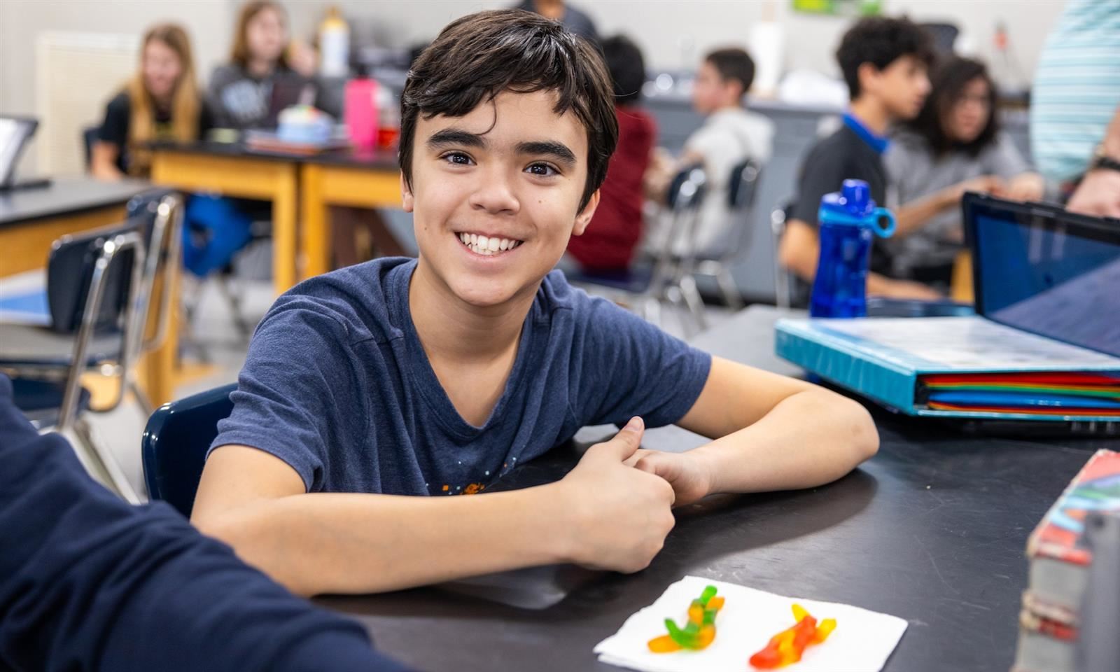 A student smiles